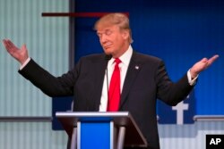 Republican presidential candidate Donald Trump gestures during the first Republican presidential debate, Cleveland IN, Aug. 6, 2015.