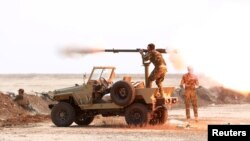 Members of a Shi'ite militia undergo training in preparation of plans to recapture Mosul, in Diyala province, Iraq, Sept. 27, 2016. Some say the presence of Shi’ite and Kurdish militiamen in the government force to liberate Mosul could inflame sectarian tensions.