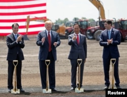 President Donald Trump, along with Terry Gou, founder and chairman of Foxconn, and Speaker of the House Paul Ryan, participate in the Foxconn Technology Group groundbreaking ceremony for its LCD manufacturing campus, in Mount Pleasant, Wisconsin, U.S.