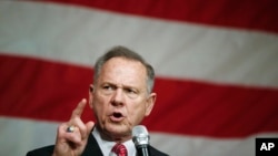 FILE - Former Alabama Chief Justice and U.S. Senate candidate Roy Moore speaks at a campaign rally, Dec. 5, 2017, in Fairhope Ala.