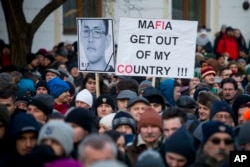 Protesters march in memory of murdered journalist Jan Kuciak and his girlfriend, Martina Kusnirova, in Bratislava, Slovakia, Feb. 28, 2018.