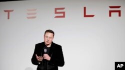 FILE - Elon Musk, CEO of Tesla Motors Inc., talks during a news conference at the company's headquarters in Fremont, California, Sept. 29, 2015.