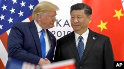 Presiden AS Donald Trump dan Presiden China Xi Jinping dalam pertemuan di sela KTT G20 di Osaka, Jepang 29 Juni 2019 lalu. 