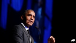 FILE - In this Dec. 12, 2018, photo, former President Barack Obama accepts the Robert F. Kennedy Human Rights Ripple of Hope Award at a ceremony in New York. 