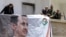 Syrians, including members of the Syrian National Defense Forces (NDF), hang a portrait of President Bashar al-Assad on June 13, 2015 in the ancient Christian town of Maalula.
