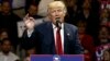 FILE - President-elect Donald Trump gestures as he speaks during a "USA Thank You" tour event in Cincinnati, Dec. 1, 2016.