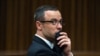 FILE - Oscar Pistorius listens to psychiatric evidence for his defense during his ongoing murder trial in Pretoria, South Africa.