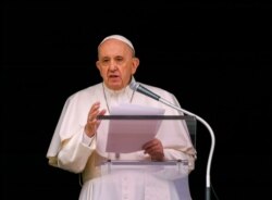 FILE - In this June 6, 2021, photo, Pope Francis speaks from the window of his studio overlooking St. Peter's Square at the Vatican to a crowd of faithful and pilgrims gathered for the Sunday Angelus noon prayer.