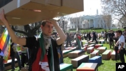 Protesters carried symbolic coffins to mark their opposition to U.S. military action.