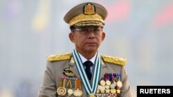 Myanmar's junta chief Senior General Min Aung Hlaing, who ousted the elected government in a coup, presides at an army parade on Armed Forces Day in Naypyitaw, Myanmar, March 27, 2021.