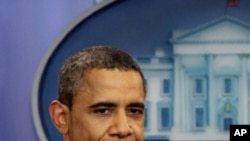 President Barack Obama arrives to speak in White House briefing room, Sunday, July 31, 2011, in Washington, about a deal being reached to raise the debt limit.