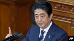 Japan’s Prime Minister Shinzo Abe delivers a policy speech during a Diet session at the lower house of Parliament in Tokyo, Sept. 26, 2016.