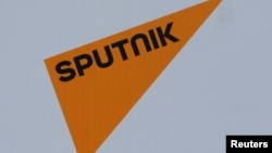 The logo of Russian state news agency Sputnik is seen on a board at the St. Petersburg International Economic Forum 2017 (SPIEF 2017) in St. Petersburg, Russia, June 1, 2017. 