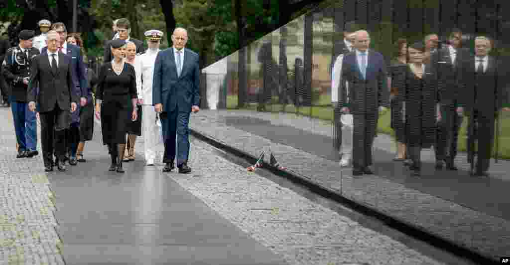Cindy McCain, wife of, Sen. John McCain, accompanied by President Donald Trump's Chief of Staff John Kelly (R) Defense Secretary Jim Mattis (L) and family members, arrives at the Vietnam Veterans Memorial in Washington, Sept. 1, 2018.