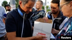 Members of the International Atomic Energy Agency (IAEA) expert mission, led by IAEA Director-General Rafael Grossi, visit the Russian-controlled Zaporizhzhia Nuclear Power Plant September 1, 2022. (REUTERS/Alexander Ermochenko)