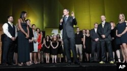 Lance Armstrong stands onstage during the 15th anniversary celebration for Livestrong, his cancer-fighting charity, in Austin, Texas, on October 19, 2012.