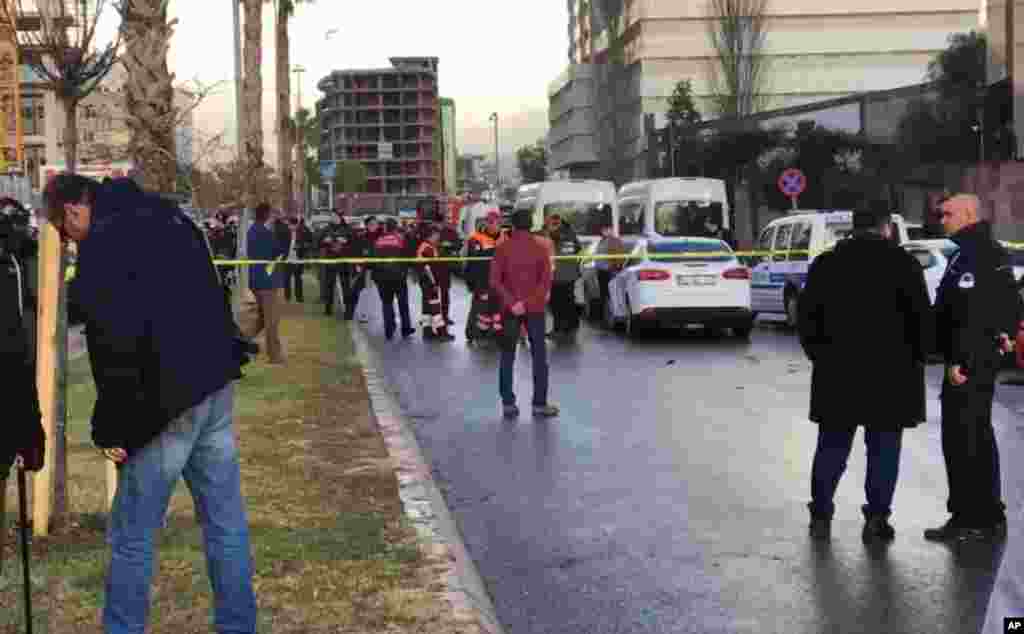 In this image taken from AP video, emergency services stand at the scene of an explosion, in Izmir, Turkey, Thursday, Jan. 5, 2017.