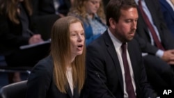 Monika Bickert, head of global policy management at Facebook, joined at right by Nick Pickles, public policy director for Twitter, testifies before the Senate Commerce, Science and Transportation Committee, Sept. 18, 2019.
