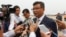 Cambodian Education Minister Mr. Hang Choun Naron talks to reporters after the departure of US First Lady Michelle Obama at Siem Reap International Airport, Sunday, March 22, 2015. (Neou Vannarin/VOA Khmer)