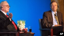 Warren Buffett and Bill Gates from a news conference in Beijing
