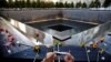 A visitor photographs the National September 11 Memorial and Museum on the 15th anniversary of the 9/11 attacks in New York, Sept. 11, 2016. The Minnesota defendant said he has been angry at Muslims since the attacks. 