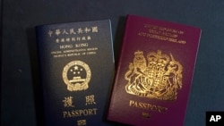 A British National Overseas passports (BNO) and a Hong Kong Special Administrative Region of the People's Republic of China passport are pictured in Hong Kong, Jan. 29, 2021.