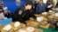 FILE - Thai policemen arrange packages of methamphetamine on a table before a press conference in Bangkok, Thailand, Feb. 15, 2013.