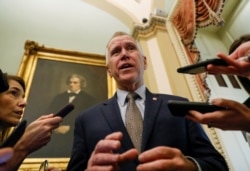 FILE - Senator Thom Tillis (R-N.C.) talks to reporters prior to the resumption of the Senate impeachment trial of U.S. President Donald Trump at the U.S. Capitol in Washington, January 30, 2020.