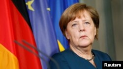 German Chancellor Angela Merkel adresses the media at the government guesthouse Meseberg Palace in Meseberg, May 20, 2017. 