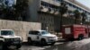 A building in front of the Dama Rose Hotel is seen after a bomb attached to a fuel truck exploded where U.N. observers are staying in Damascus, Syria, Aug. 15, 2012. 