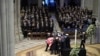 The flag-draped casket of former President Jimmy Carter is removed by honor guards after his state funeral at Washington National Cathedral in Washington, Jan. 9, 2025.