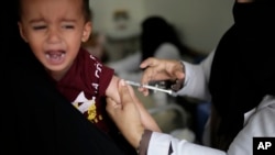 A boy reacts as he receives a diphtheria vaccine at a hospital in Sanaa, Yemen, Sept. 9, 2019. 