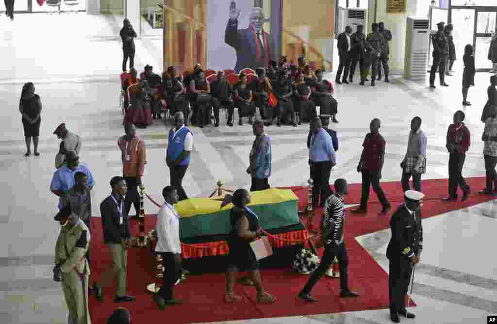 Members of the public pay their respects as the coffin of former U.N. Secretary-General Kofi Annan lies in state at the Accra International Conference Center in Ghana.