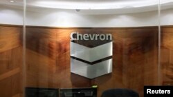 FILE - The logo of Chevron is seen at the company's office in Caracas, Venezuela, April 25, 2018.