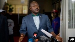 FILE - President Pierre Nkurunziza makes a brief statement at the presidential palace in Bujumbura, Burundi, May 17, 2015. 