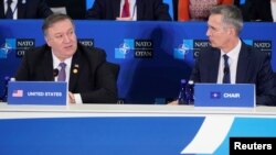U.S. Secretary of State Mike Pompeo speaks as NATO Secretary General Jens Stoltenberg (R) listens during a meeting of the North Atlantic Treaty Organization (NATO) Foreign Ministers at the State Department in Washington, U.S., April 4, 2019. 