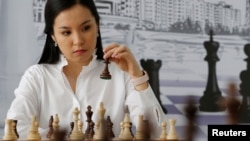 Dinara Saduakassova, a 23-year-old Kazakh chess player and social activist, poses for a picture in the Chess Academy she founded in Nur-Sultan, Kazakhstan March 3, 2020. (REUTERS/Pavel Mikheyev)