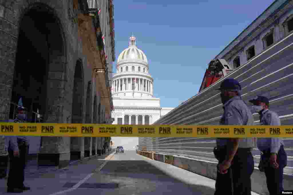 A police line is seen blocking a road leading to the National Capitol Building, in Havana, Cuba, July 12, 2021. 