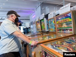 Guests visit Silverball Retro Arcade, which is home to more than 150 fully functional pinball machines in Asbury Park, New Jersey, U.S., August 12, 2022. (REUTERS/Roselle Chen))))