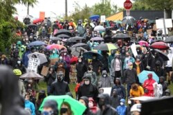 Demonstrators walk during a Black Lives Matter of Seattle-King County silent march on June 12, 2020 in Seattle, Washington.