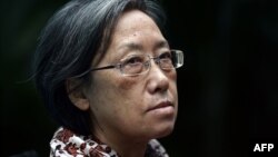 FILE - This picture taken on December 10, 2014 shows Ng Shui-Meng, the wife of missing Laotian activist Sombath Somphone, posing for a picture ahead of an interview with AFP at a hotel in Bangkok. 