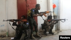 FILE - Somali security forces hold their positions near the mayor's office following a blast in Mogadishu, Somalia, Jan. 22, 2023. Authorities reported that at least 20 al-Shabab militants were killed in a military strike in central Somalia on Jan. 25, 2024.