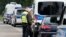 German police officers check the documents of a driver of a car with French license plates near the border with Belgium, in Aachen, Germany, Sept. 16, 2024, as Germany begins expanding checks at all of its land borders.