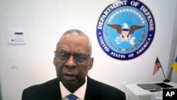 Defense Secretary Lloyd Austin provides opening remarks to the Ukraine Defense Contact Group on Jan. 23, 2024, from his home in Great Falls, Virginia. Austin has been recuperating at home from complications from prostate cancer treatments. (Department of Defense via AP)