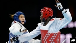 Ivory Coast's Ruth Gbagbi, in red, competes at the 2012 London Olympics. She will be back competing for her country in Brazil this August.