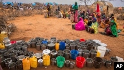 FILE - People wait for food and water in the Warder district in the Somali region of Ethiopia, Jan. 28, 2017.