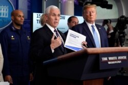 Vice President Mike Pence speaks as President Donald Trump listens during a press briefing with the coronavirus task force, at the White House, March 16, 2020, in Washington.