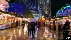 Visitors walk the grounds of the Christmas market at the Breitscheidplatz in Berlin, Nov. 27, 2017. 