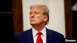FILE - Republican presidential candidate and former U.S. President Donald Trump attends the 2024 Senior Club Championship award ceremony at his Trump International Golf Club in West Palm Beach, Florida, March 24, 2024. 