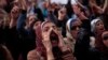 Egyptian protesters chant anti-government slogans during a rally in Tahrir Square, Cairo, Egypt, Feb. 1, 2013. 